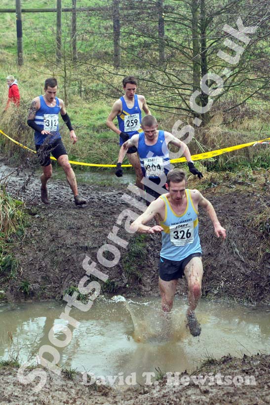 Andrew Wiles (New Marske) leads from 304 Peter Newton, Lewis Timmins (both Morpeth) and 259 Carl Smith through the stream during the 2012 North East Championships, Summerhill Country Park, Hartlepool.
